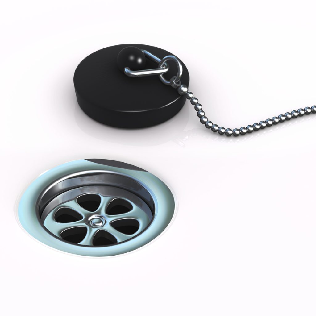 Image of a shower drain and plug to help illustrate common causes of clogged drains and What Dissolves Hair in a Drain?