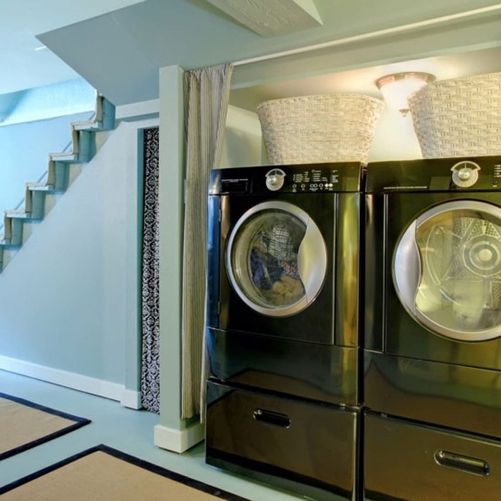 Dark colored washing machine and dryer to help illustrate energy and water saving tips and How to Unclog a Washing Machine Drain