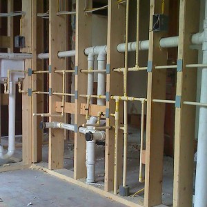 Plumbing inside of a home being remodeled