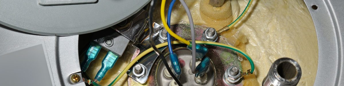 An opened water heater element exposing wires and more